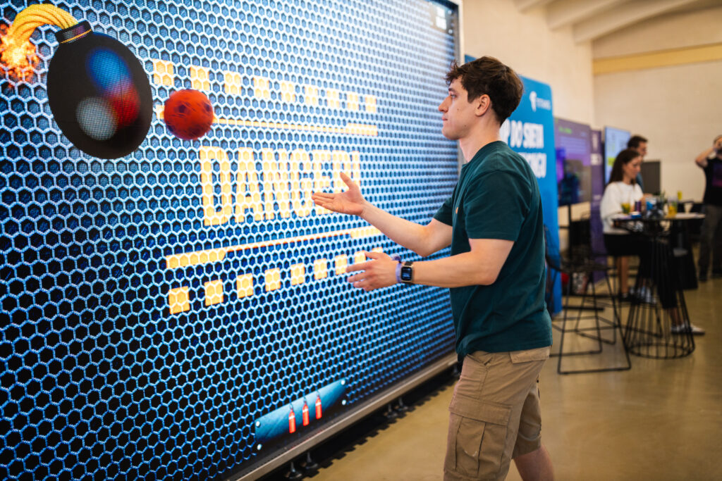 TITANS drew attention at CODECON Bratislava 2024 with an interactive wall where freelancers could enjoy various ball games. 