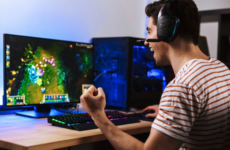A man playing a video game. Many programmers favour C#, which is used in the development of games, applications, and websites.