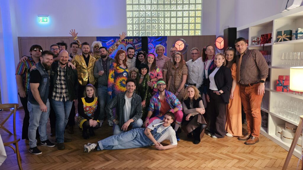 TITANS CEO, employees, and business partners at a retro Christmas party